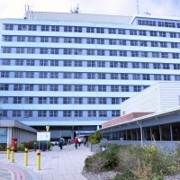 Main entrance of Boston hospital, tall building with a paved entrance