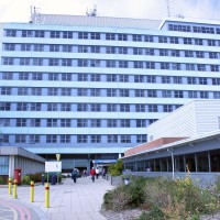 Main entrance of Boston hospital, tall building with a paved entrance